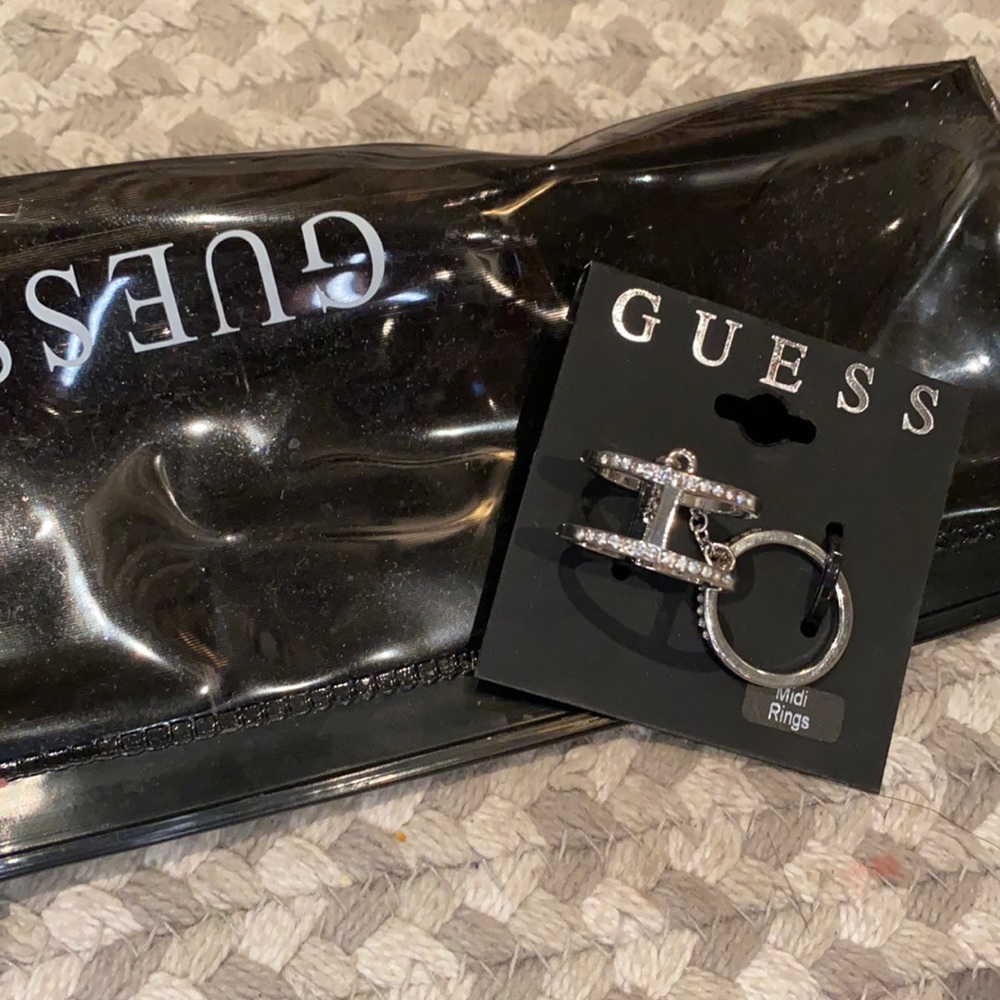 Size 7 Guess studded rings attached by chain